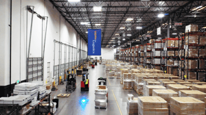 forklifts driving in warehosue