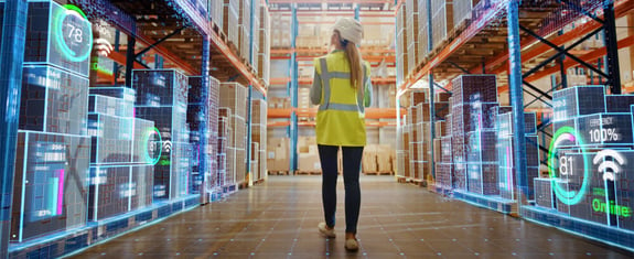 Woman walking through 3PL warehouse with graphics signifying growth