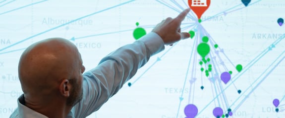 Man pointing to transportation management map